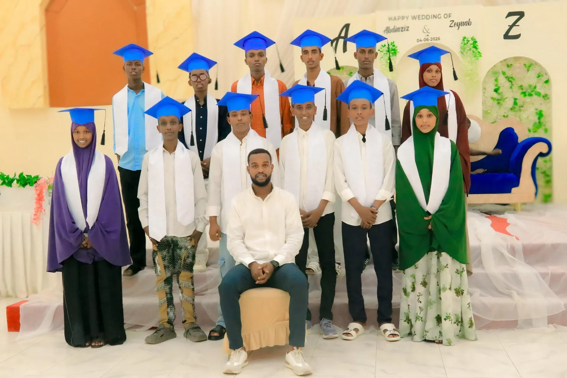 SAFCE graduating class in blue caps with their instructor